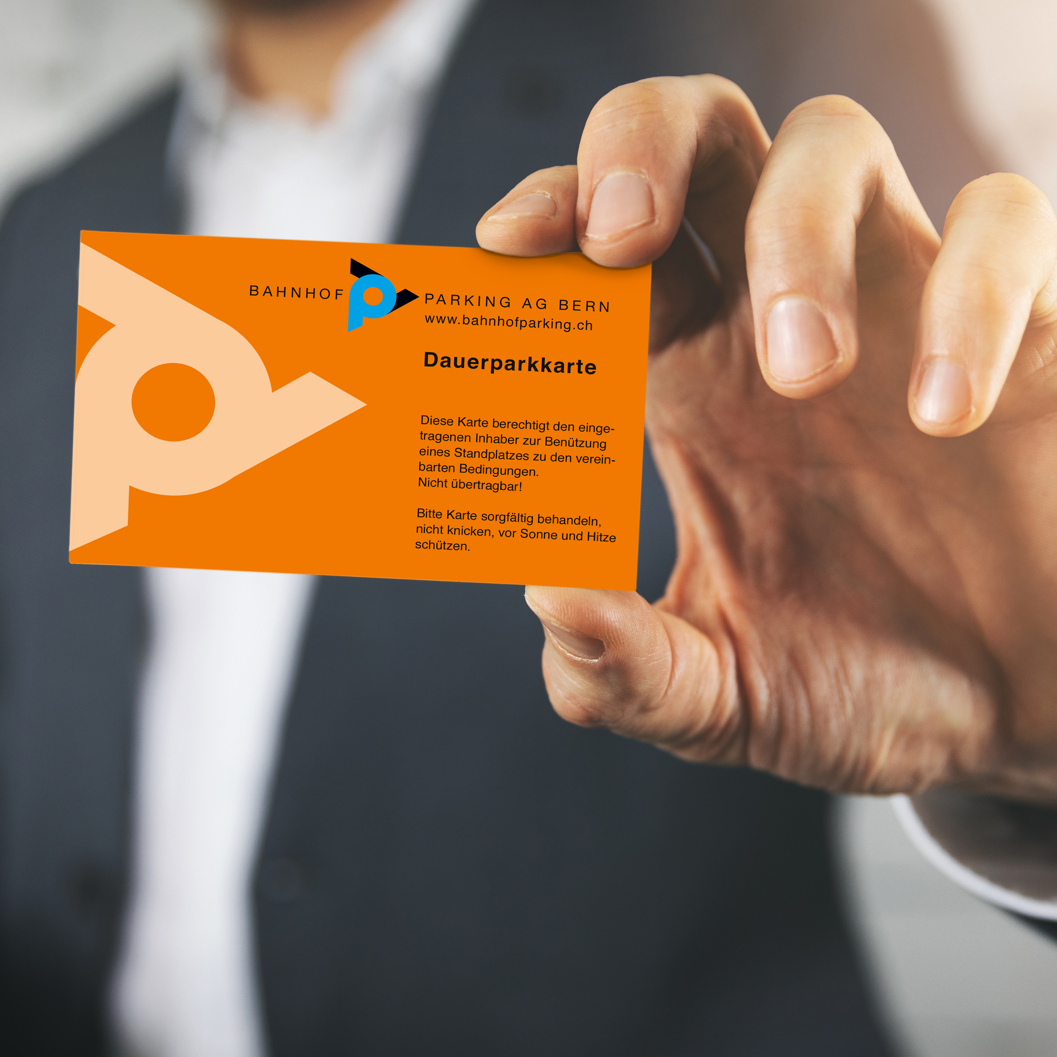 businessman hand showing blank white business card closeup